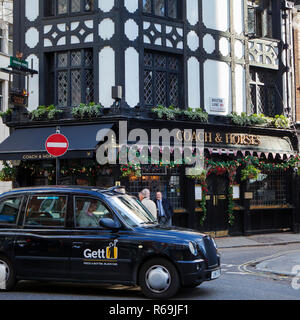 LONDON, UNITED KINGDOM - NOVEMBER 30th, 2018: Traditional english pub in Central London gets decorated with Christmas ornaments Stock Photo