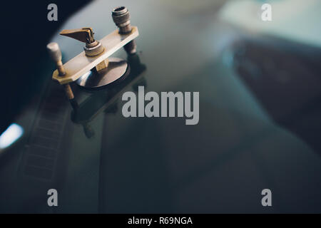 Glazier using tools repairing fix crack windshield Stock Photo