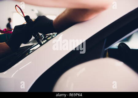 Using tools repairing to fix crack windshield Stock Photo