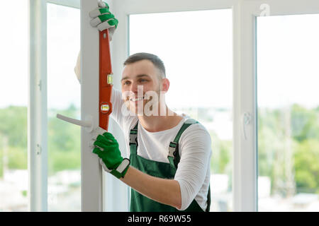 Man using a bubble level Stock Photo