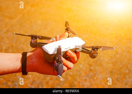 The handle holds the plane up in the sky with Soil background. Stock Photo
