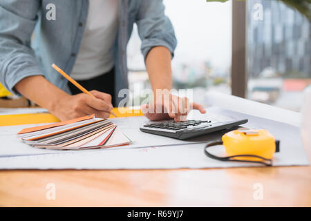 Workplace items tools for project, Architect or Engineer working on blueprint for architectural project in progress, construction and structure concep Stock Photo