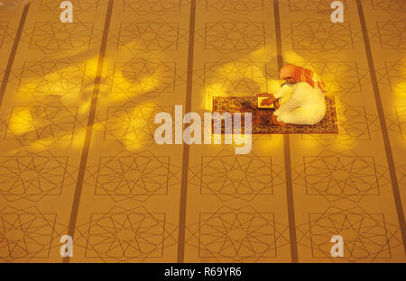 Namaz Muslim prayer reading Koran, India, Asia Stock Photo