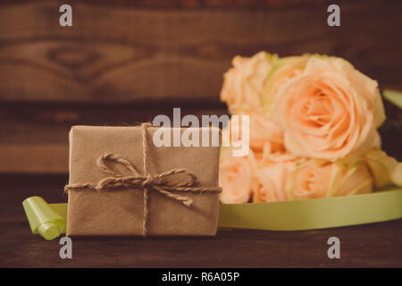 gift or present box and flowers. a gift for Valentine's day or a woman's day Stock Photo