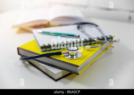 medical education - medicine books and notes on the table Stock Photo