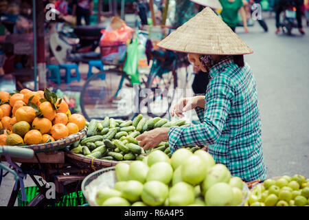 Fresh vegetables and fruits in traditional street market in Hanoi, Vietnam. Stock Photo