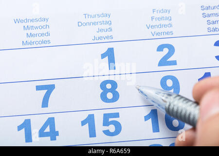high angle view of weekly planner and notepad on table Stock Photo - Alamy