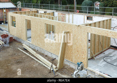 Timber frame house extension or annexe under construction in the UK Stock Photo