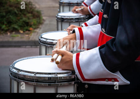 Various details of a performing wind band during a performance or concert with brass and percussion instruments Stock Photo