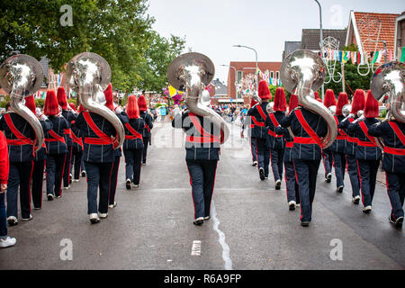 Various details of a performing wind band during a performance or concert with brass and percussion instruments Stock Photo