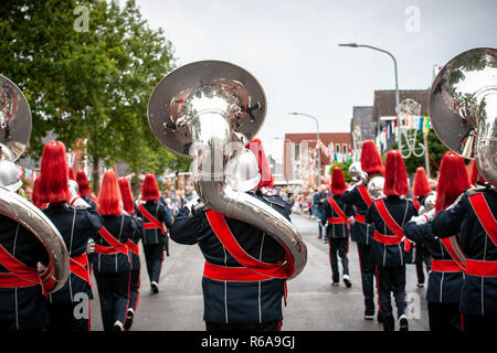 Various details of a performing wind band during a performance or concert with brass and percussion instruments Stock Photo