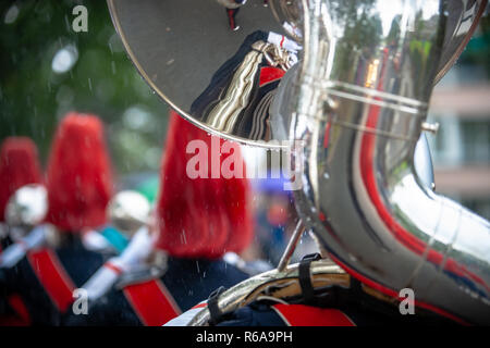 Various details of a performing wind band during a performance or concert with brass and percussion instruments Stock Photo