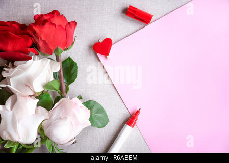 Roses bouquet and blank paper sheet Stock Photo