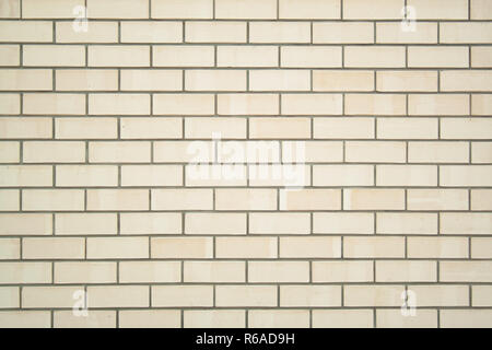Beige bricks wall texture. New clean beige bricks background Stock Photo