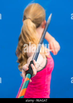 young woman javelin throwing in athletics Stock Photo