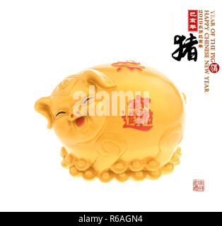 Gold piggy bank,Chinese calligraphy translation: pig.Red stamps translation: Chinese calendar for the year of pig 2019.Red calligraphy on pig mean goo Stock Photo