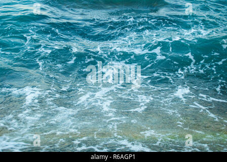 Abstract blue background of frothy sea surface. Stock Photo
