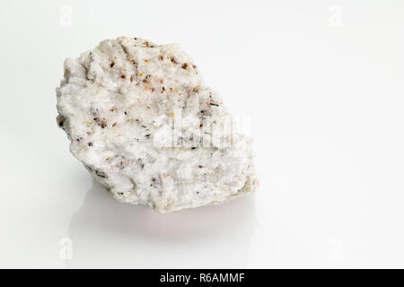 Sanidine: high temperature form of potassium feldspar with a general formula K(AlSi3O8), from Vesuvius volcano isolated on a white background, Naples, Stock Photo