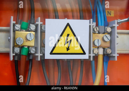 High voltage sign. Electrical relays and wires. Stock Photo