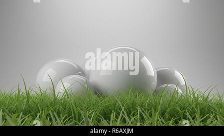 3d rendering of reflective spheres with grass Stock Photo