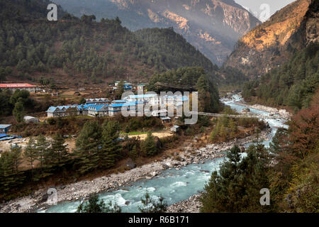 Nepal, Phakding, lodges by bridge to east side of Dudh Kosi River, late afternoon Stock Photo