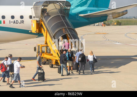 Verona, Italy - September 2018: Passengers boarding a holiday jet at Verona, Italy Stock Photo