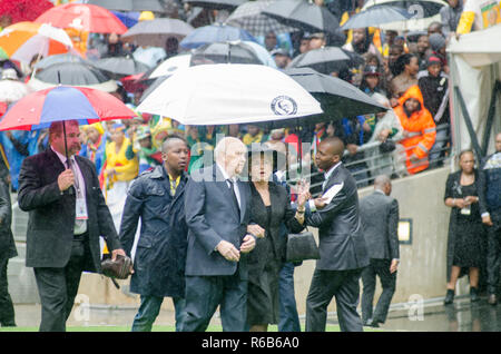 Former South African President FW de Klerk (F.W. for Frederik Willem) and wife Elita arrive at the memorial for former South African President Nelson Mandela at FNB Stadium, in Soweto, South Africa, Tuesday December 10, 2013. PHOTO: EVA-LOTTA JANSSON Stock Photo