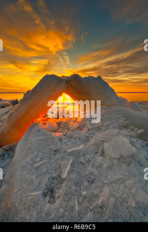 Winter landscape of ice pilings - bridge along shores of Lake St. Clair in Southeast Michigan, Metro Detroit area, USA Stock Photo