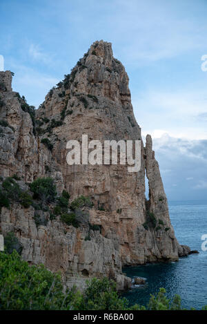 beach with rocks at the italian island sardinia in mediterranean sea Stock Photo