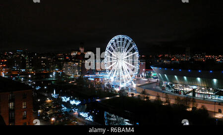 Liverpool, UK - December 1st 2018: The Wheel of Liverpool illuminated at night. The wheel is a tourist attraction near Albert Dock. Stock Photo