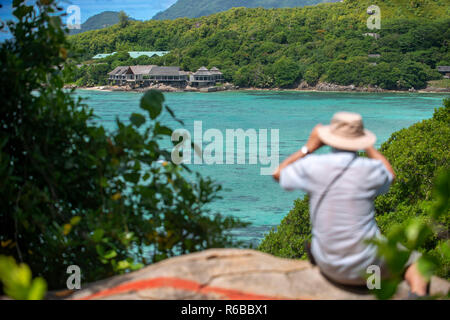 Tourists in Moyenne Island Seychelles Ste Anne Marine National Park off the north coast of Mahé Stock Photo