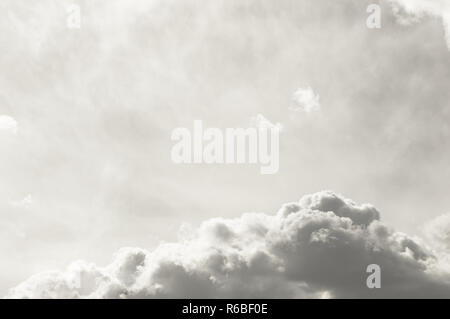 Background full of white clouds of different types. Cloudscape with light and thick clouds with copy space above. Mystical and abstract background. Stock Photo