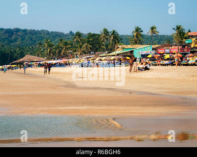 Baga, Goa, India - Dec 5, 2014 Crowded Baga Beach with restaurant shacks in North Goa Stock Photo