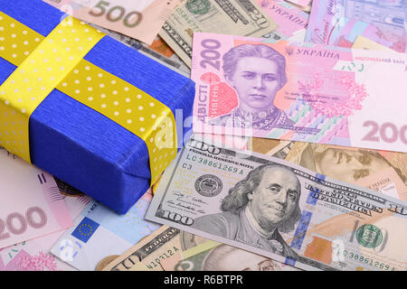 banknotes, clear image of dollars and new bills Ukrainian national currency hryvnia with gift box Stock Photo