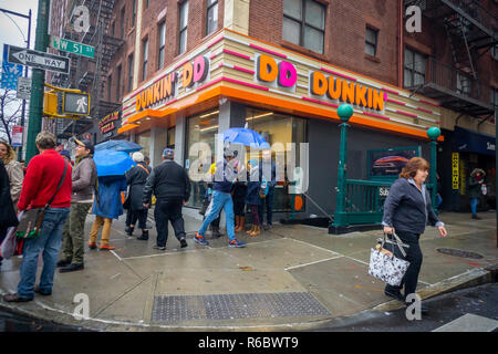 A Dunkin' Donuts franchise in Midtown in New York on Sunday, December 2, 2018. Dunkin' Brands is in the process of removing 'donuts' from it eponymous chain and it will henceforth only be known as 'Dunkin''. Beverage sales account for 60 percent of the company's business but it has no plans to drop doughnuts from its tasty choices. The change will officially start in January 2019. (© Richard B. Levine) Stock Photo