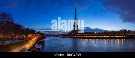 Eiffel Tower and  Seine River banks in early morning light. Panoramic view in Paris, France Stock Photo