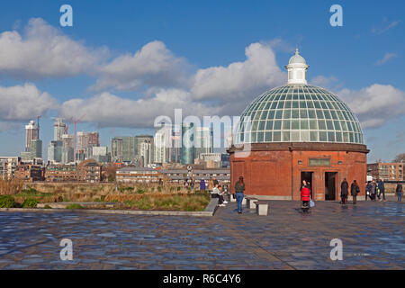 Greenwich Foot Tunnel of 1902, linking Greenwich with the Isle of Dogs. Canary Wharf  north of the river is in the background. Stock Photo