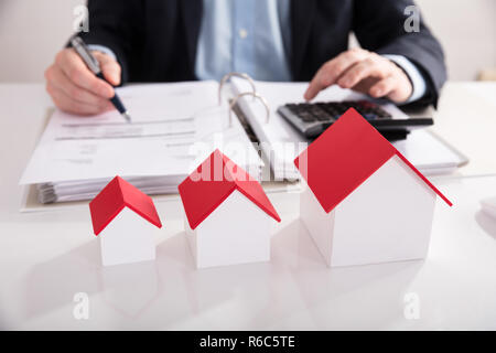 Different Size Of House Model In A Row Stock Photo