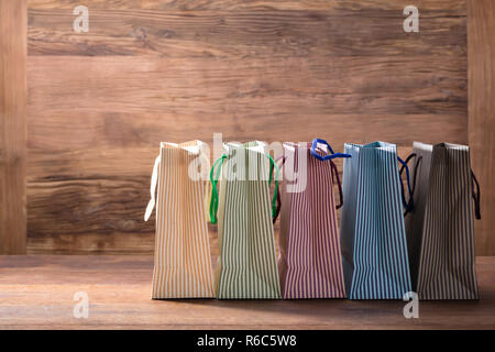 Colorful Striped Shopping Bags In Row Stock Photo