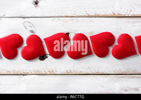 Red hearts pattern on white background. Top view. Stock Photo