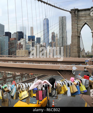 Love locks on the Brooklyn Bridge, New York, with the Manhattan Skyline in the background. Stock Photo