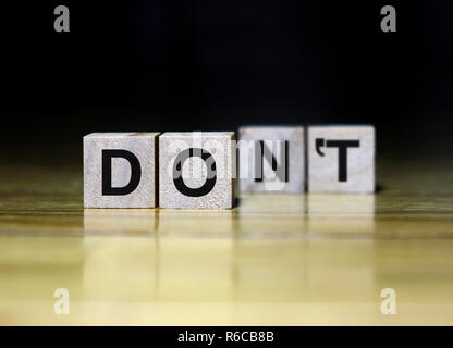The words Do and Don't on wooden cubes - depending on the perspective Stock Photo