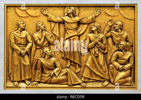 One of the golden bas-relief of the old Basilica of Fatima representing one of the fourteen mysteries of the rosary (similar to the stations of the cr Stock Photo