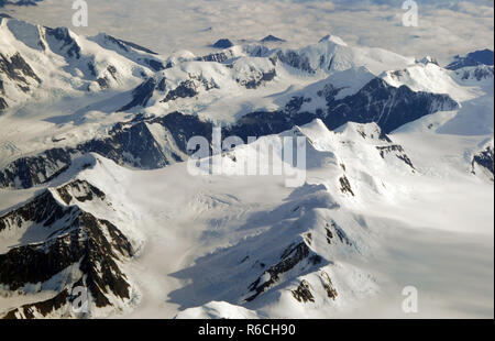 The Chugach Mountains near Valdez, Alaska in summer snow seen from above. Stock Photo