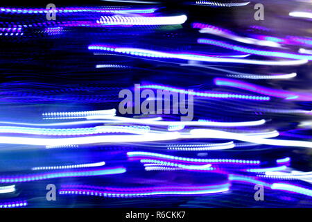 Abstract Blurred Background, Colourful speed and movement lights, Multi toned coloured lights, Mixed blue, purple, gold and green blurred lights