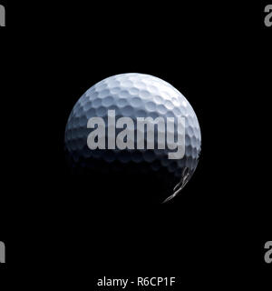 Detailed close of white dimpled golf ball in shadow, black background Stock Photo