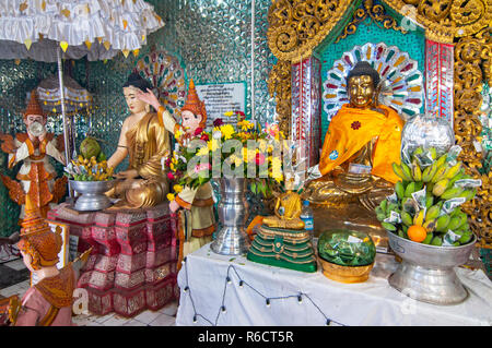 Buddha Statue And Donations, Popa Taung Kalat Temple, Mount Popa, Near Bagan, Myanmar, (Burma) Stock Photo