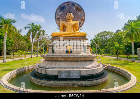 Beautiful Landscape And Golden Buddha Statue In Viharamahadevi Park, Colombo, Sri Lanka Stock Photo