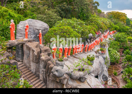 Procession Of Sculptured Buddhist Monks Dambulla Caves Cultural Triangle Sri Lanka Stock Photo