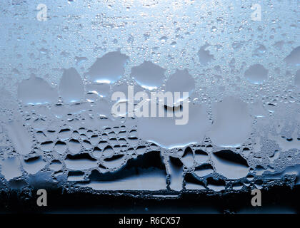 Condensation, Vapor, Rain, Water Drops Of Various Sizes On A Glass Surface. Stock Photo